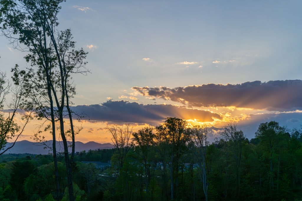 Dramatic Blue Ridge sunset through clouds at Reynolds Mountain