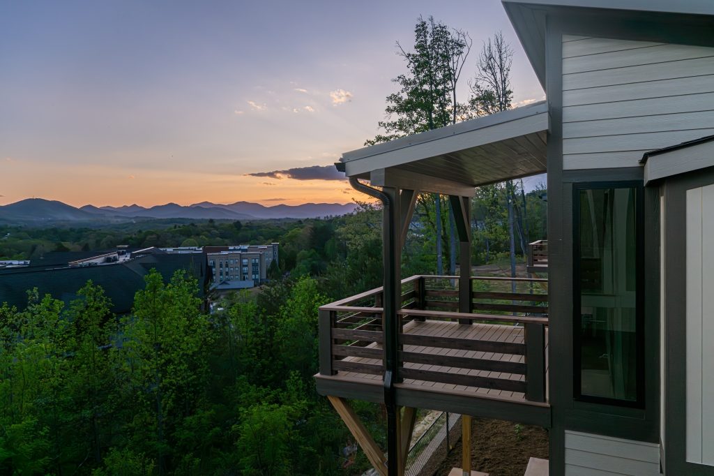 Covered upper terrace at twilight, finished over a concealed Trex Rain Escape drainage system