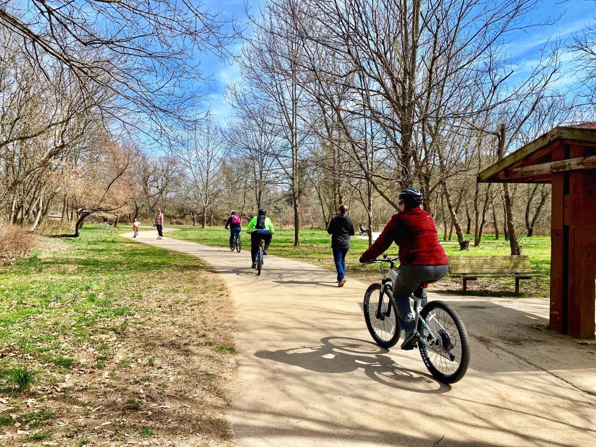 Cycling on Asheville greenway trails — the outdoor lifestyle that draws Florida buyers to the Blue Ridge