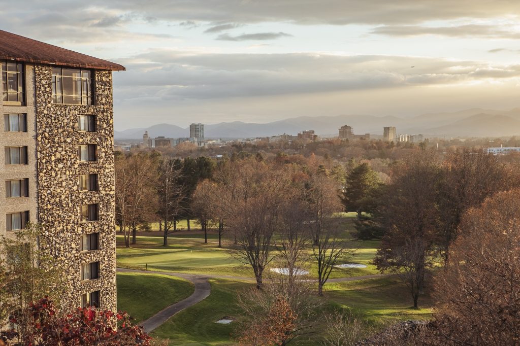The Donald Ross golf course at The Omni Grove Park Inn with downtown Asheville and the Blue Ridge Mountains beyond