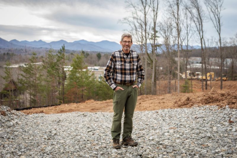 Harold Kessler on the Reynolds Mountain Villas site — Blue Ridge Mountains behind him