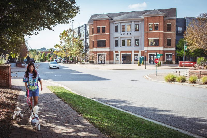 Reynolds Village — dog walking on a sunny morning past the YMCA, half a mile from Reynolds Mountain