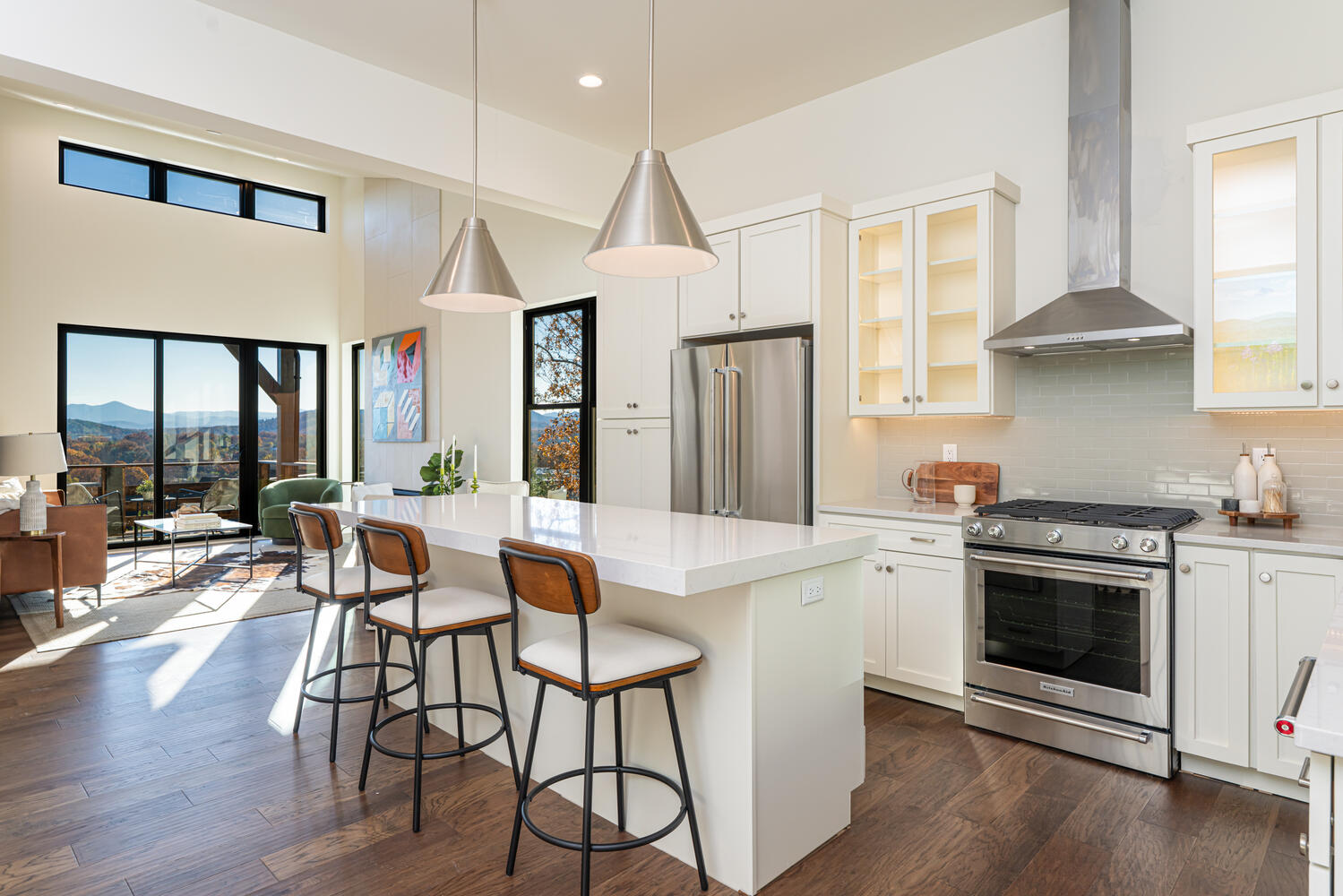 Chef's kitchen with mountain views through floor-to-ceiling windows