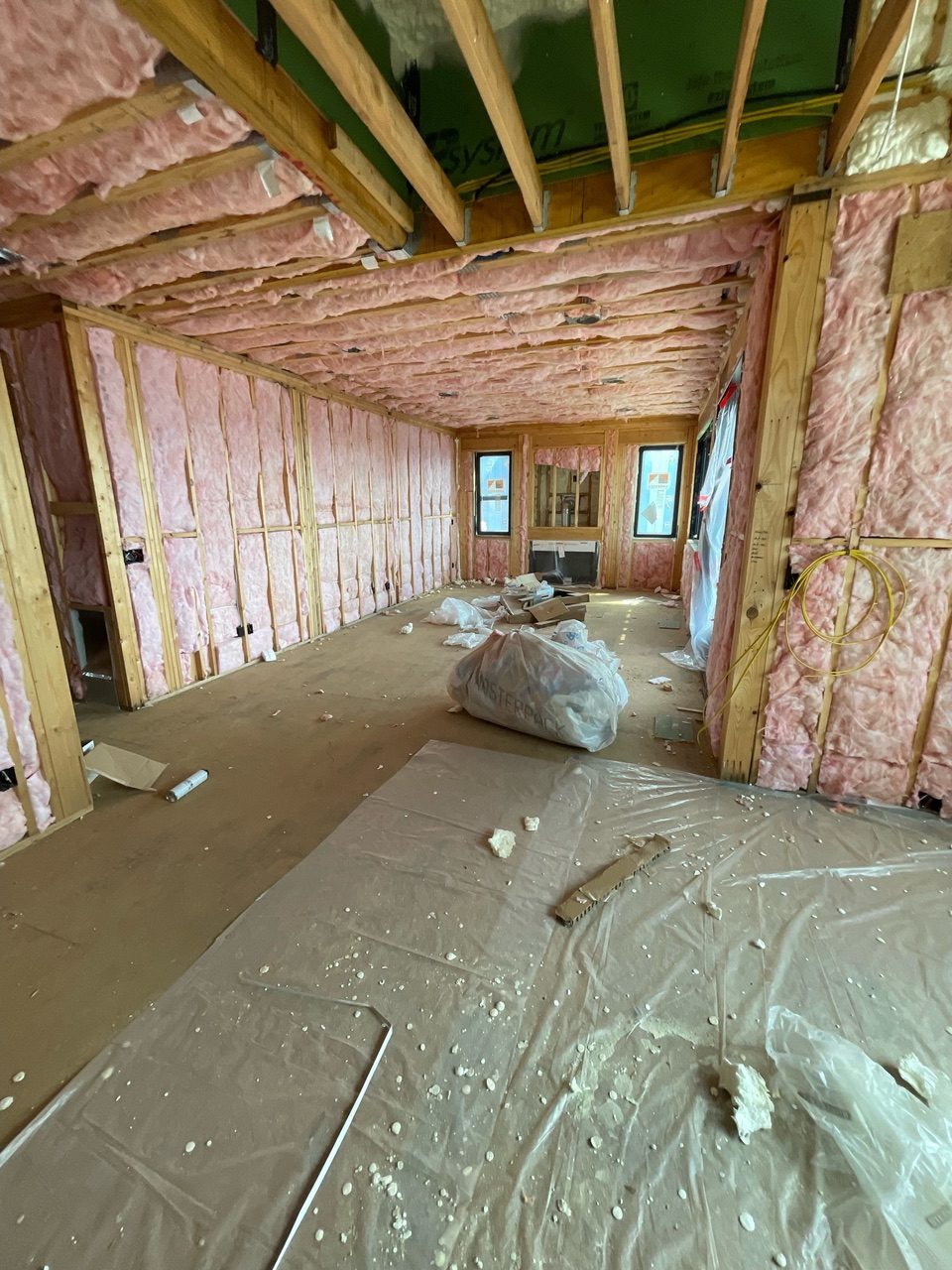 Insulation batts fill every wall and ceiling during construction at Reynolds Mountain Villas
