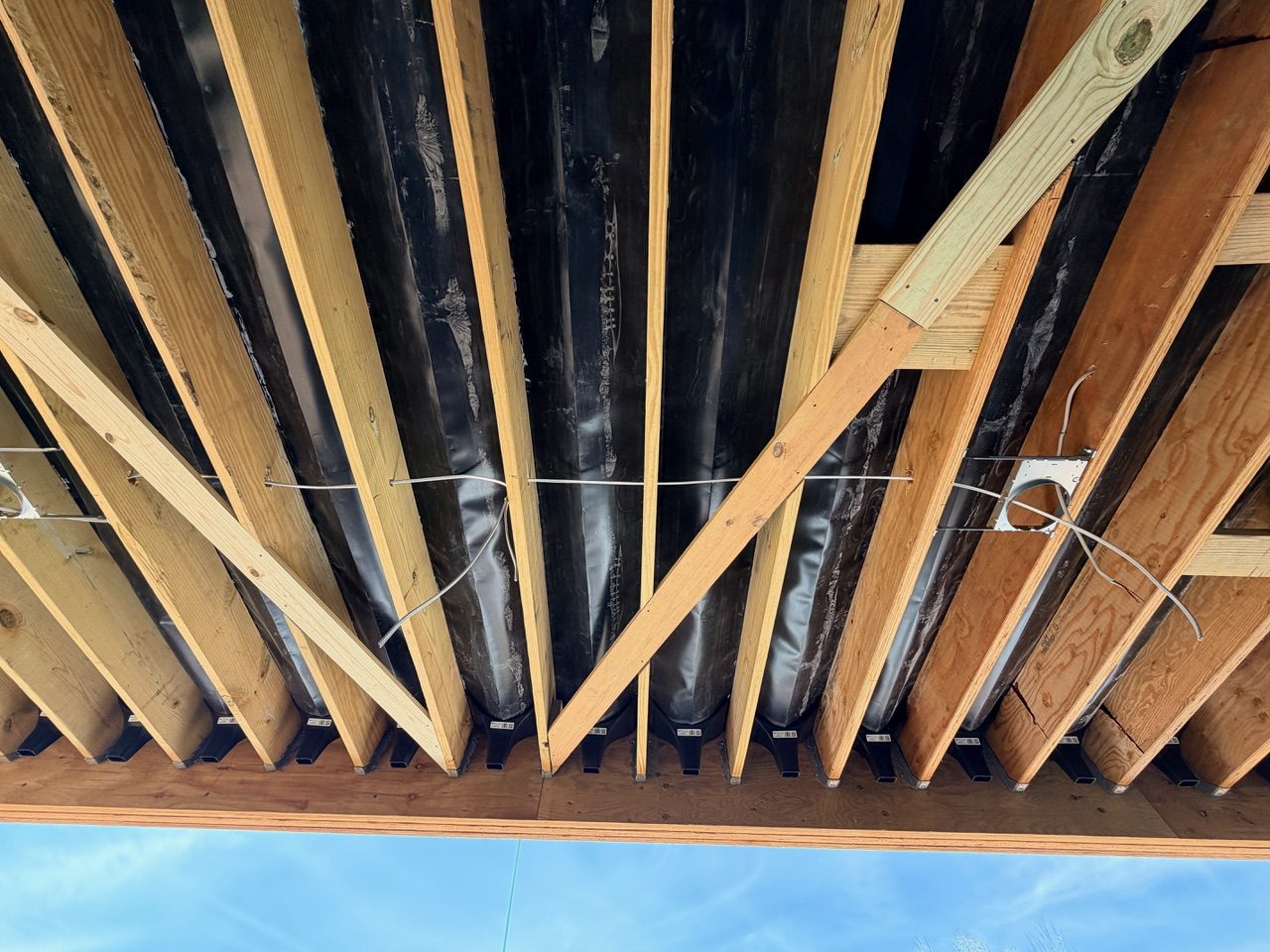Trex Rain Escape drainage channels installed beneath an upper terrace at Reynolds Mountain Villas