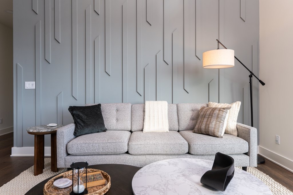 Living room detail with custom paneled accent wall