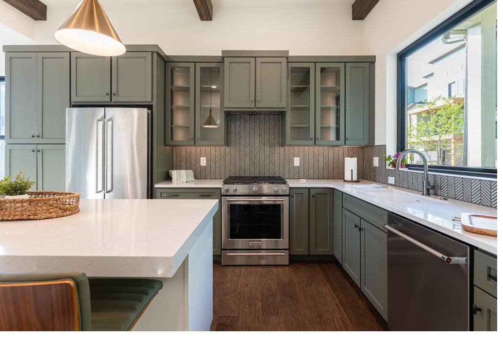 Kitchen detail with herringbone backsplash and gas range