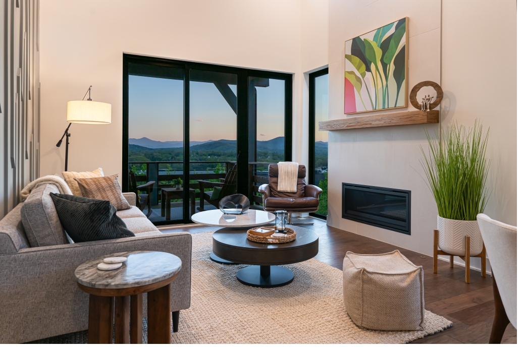 Summit Collection living room with Blue Ridge views at golden hour