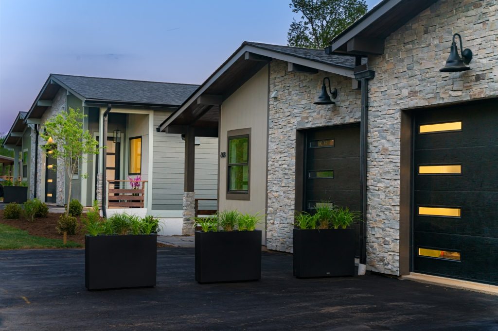 Reynolds Mountain Villas at dusk — the finished result, already here