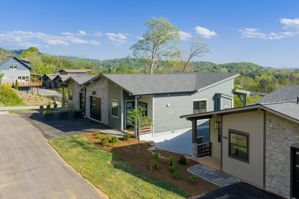 Reynolds Mountain Villas — paired villas with natural light on three sides, not a row of townhomes